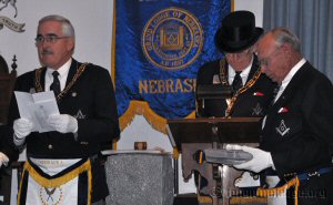 Grand Secretary Bruce Watkins reads the contents of the Time Capsule while WBro. Gerald Verbeek as Grand Custodian ceremonially deposited the contents to the building cavity
