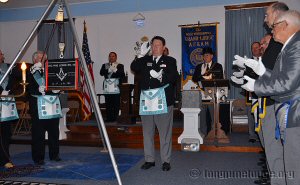 Grand Marshal John Maxell led the brethren in giving grand honors of 'three time three'