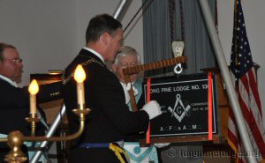 Deputy Grand Master E.David Watts testing the stone with the Square