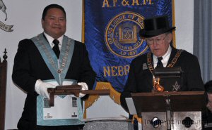 The Grand Master returning the  implements of operative Masonry to the Worshipful Master